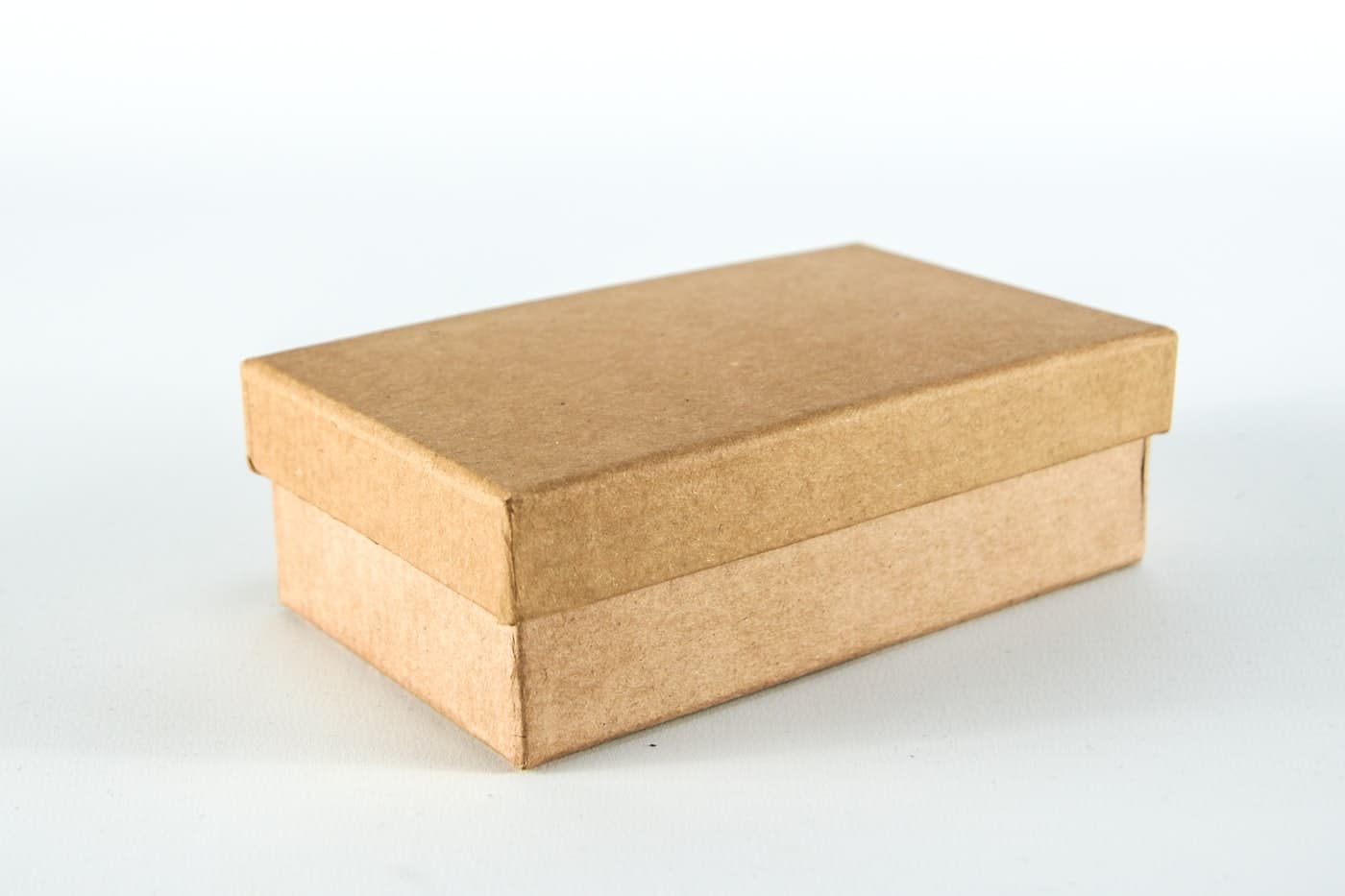 A plain brown corrugated carton on a white background