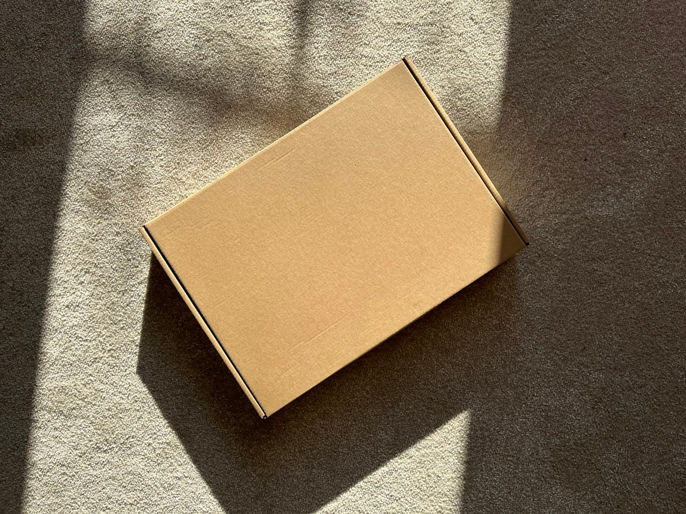 A textured corrugated cardboard sheet surface